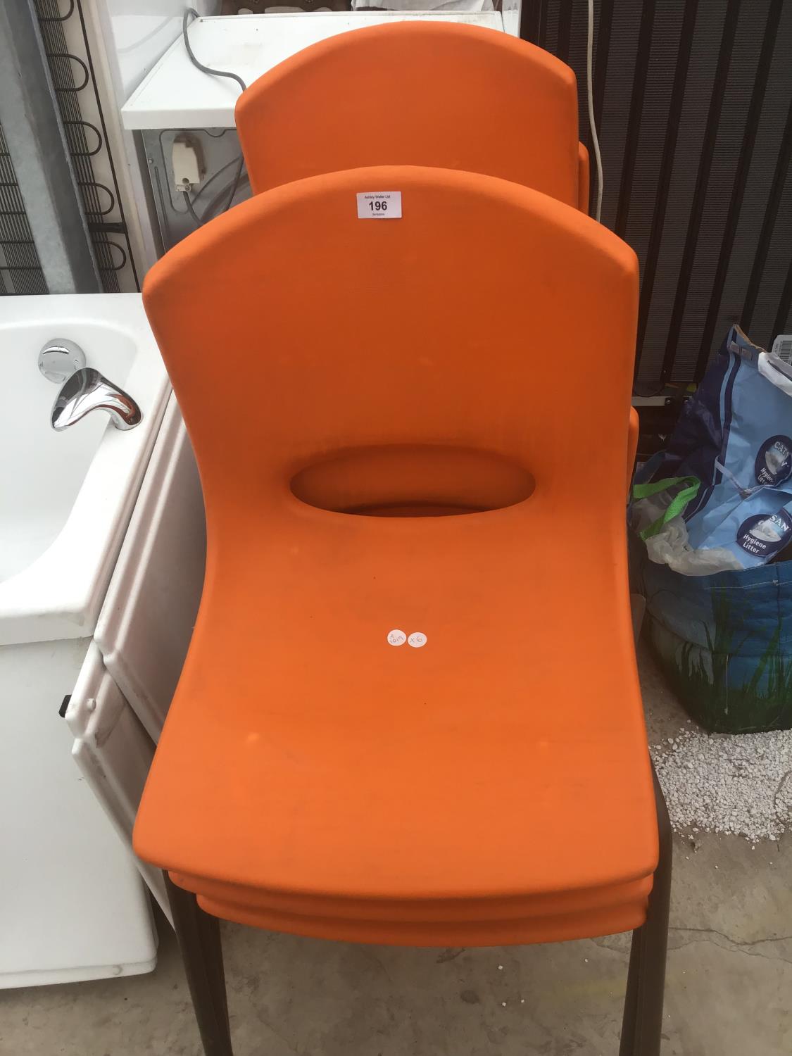 SIX RETRO ORANGE PLASTIC STACKING CHAIRS ON METAL SUPPORTS