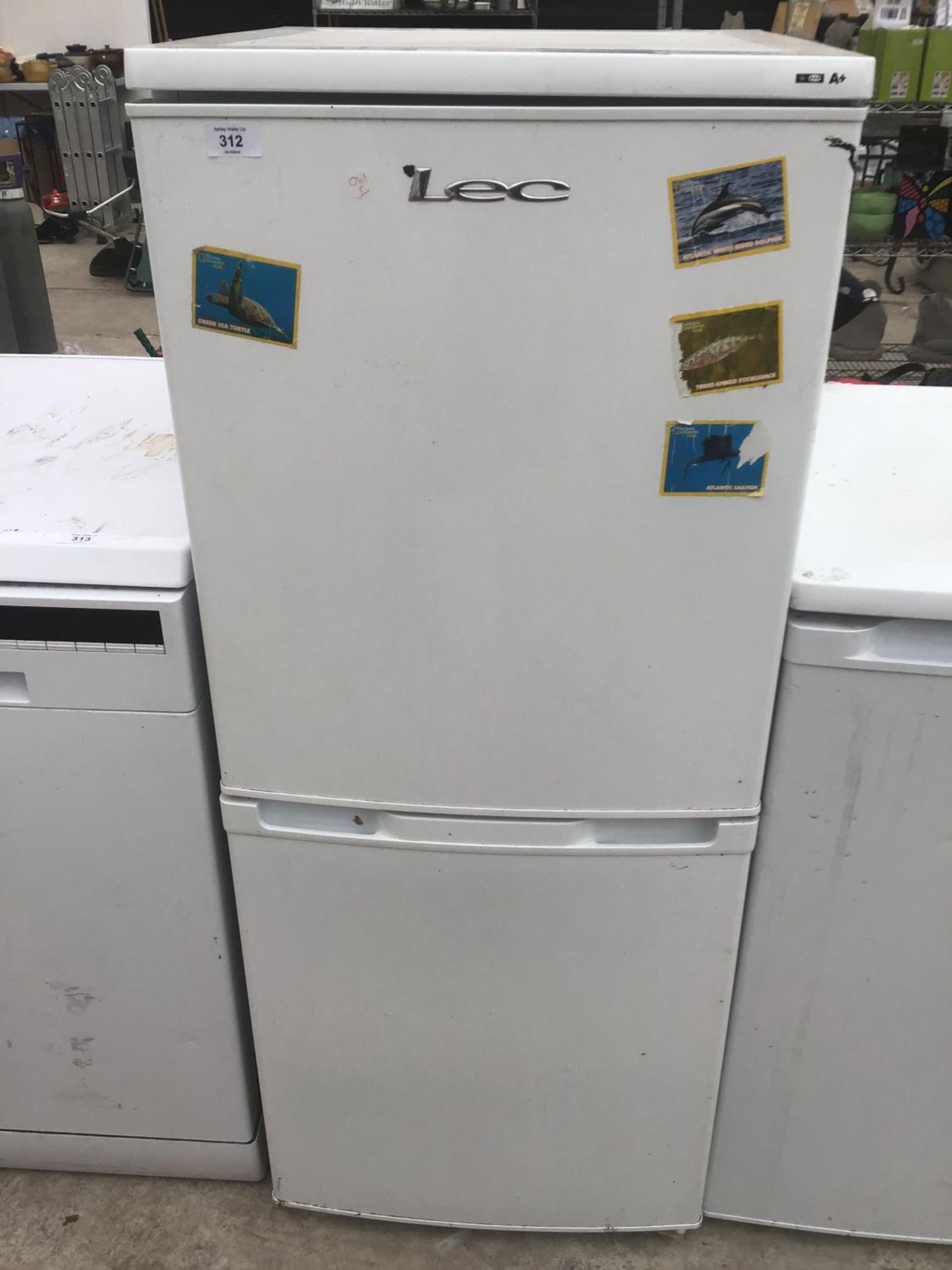 A LEC FRIDGE FREEZER IN WORKING ORDER (SOME RUST ON SHELVES)