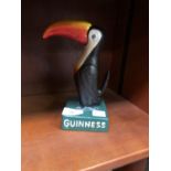 A CAST METAL GUINNESS TOUCAN MODEL