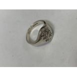 A SILVER THREE LIONS RING