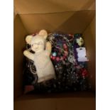 A LARGE CARDBOARD BOX OF COSTUME JEWELLERY TOGETHER WITH VINTAGE TOY
