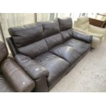A BROWN LEATHER THREE SEATER SOFA