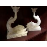A NEAR PAIR OF WEDGWOOD DRABWARE BENTLEY DOLPHIN CANDLESTICKS