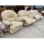 A MAHOGANY CREAM UPHOLSTERED THREE SEATER SOFA AND TWO ARMCHAIRS