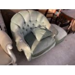 A GREEN BUTTON BACK BEDROOM ARMCHAIR AND FOOTSTOOL