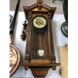 A MAHOGANY CASED VIENNA WALL CLOCK WITH PENDULUM AND KEY