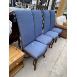 FOUR HIGH BACK UPHOLSTERED DINING CHAIRS ON ORNATE MAHOGANY SUPPORTS