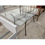 A GLASS TOP DINING TABLE ON WROUGHT IRON SUPPORT