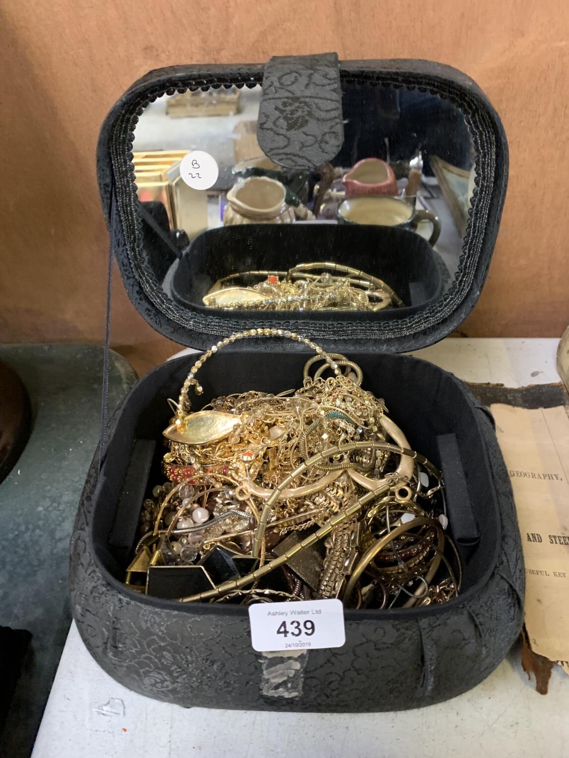 A BOX OF YELLOW METAL JEWELLERY