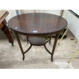 AN OVAL MAHOGANY SIDE TABLE WITH LOWER SHELF