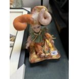 A CERAMIC MARDI-GRAS CLOWN MUSICAL WIND UP TOY