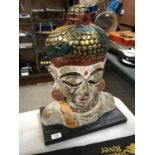 A LARGE WOODEN BUDDHA HEAD MODEL