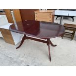 A MAHOGANY DINING TABLE