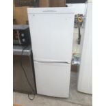 A CANDY FRIDGE FREEZER IN WORKING ORDER