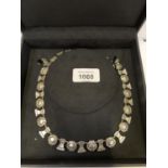 A BOXED WHITE METAL NECKLACE