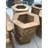 FOUR HEXAGONAL WOODEN PLANTERS