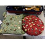 TWO CUSHIONS WITH VARIOUS PIN BROOCHES