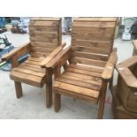 A PAIR OF WOODEN GARDEN ARM CHAIRS