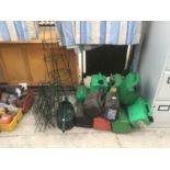 A LARGE QUANTITY OF PLASTIC PETROL CANS, A WATERING CAN AND TRELLIS