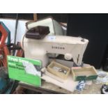 A VINTAGE SINGER SEWING MACHINE WITH BAG, PEDAL, ATTACHMENT AND PATTERNS IN WORKING ORDER
