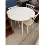 A CIRCULAR WHITE KITCHEN TABLE AND THREE CHAIRS