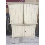 A VICTORIAN PINE PAINTED HOUSEKEEPERS CUPBOARD WITH FOUR DOORS
