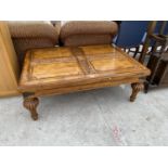 A CARVED MAHOGANY COFFEE TABLE