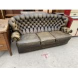 A BROWN LEATHER THREE SEATER CHESTERFIELD SOFA