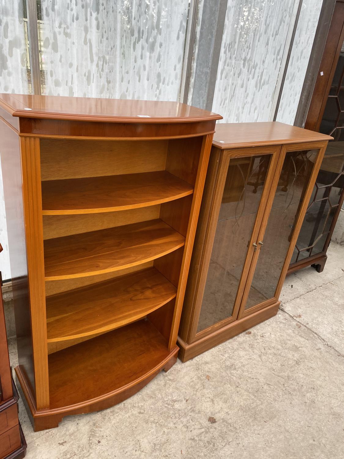 A YEW WOOD FOUR TIER BOOKCASE AND A MAHOGANY EFFECT CABINET WITH TWO GLAZED DOORS