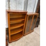A YEW WOOD FOUR TIER BOOKCASE AND A MAHOGANY EFFECT CABINET WITH TWO GLAZED DOORS