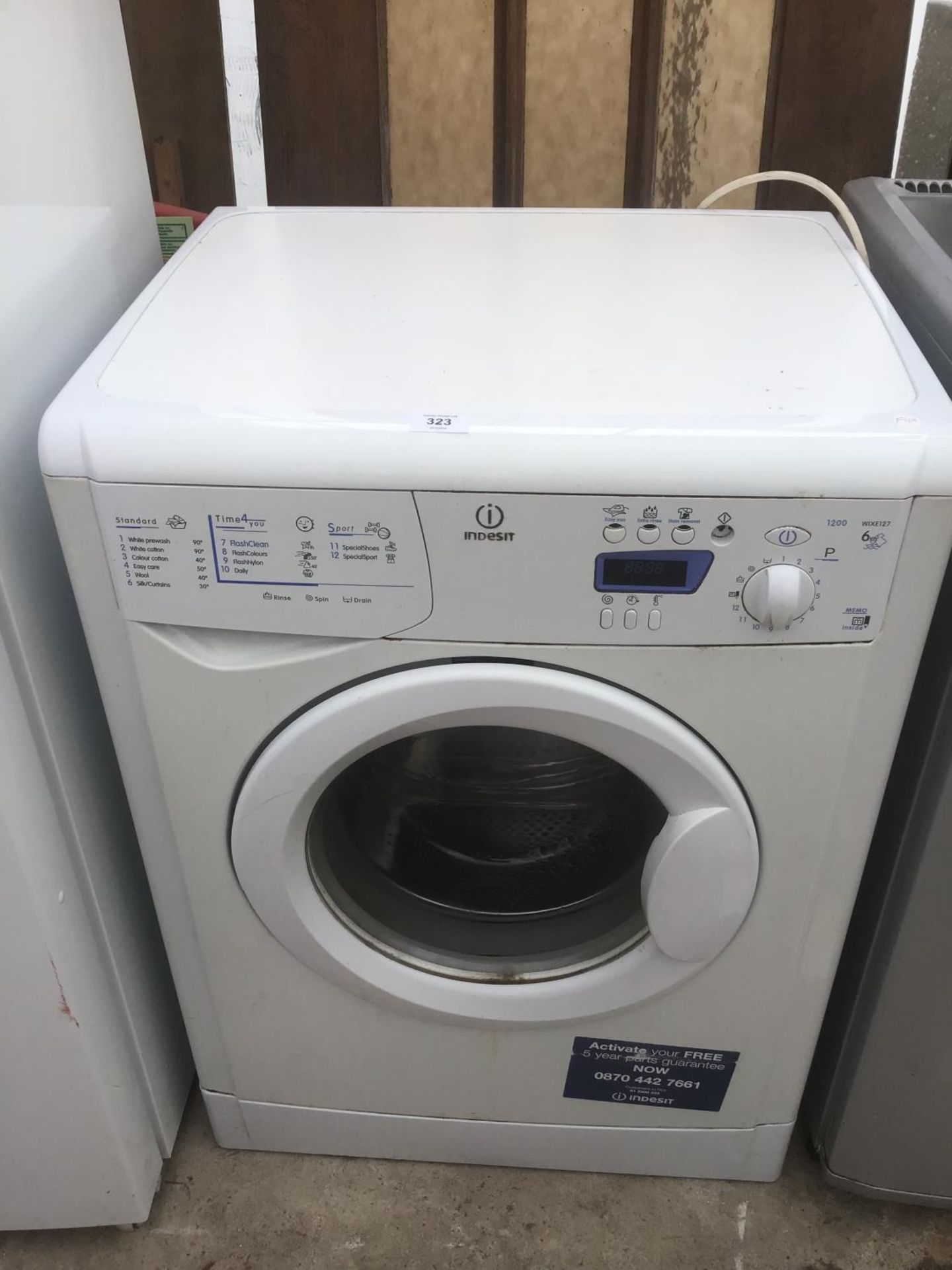 AN INDESIT WASHING MACHINE (WILL WORK BUT FAULT ON A DOOR SWITCH)