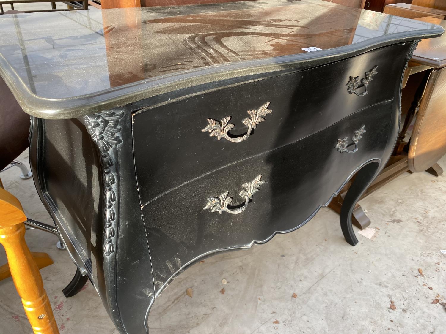 AN ORNATE BLACK CHEST OF DRAWERS WITH TWO LONG DRAWERS - Image 2 of 2