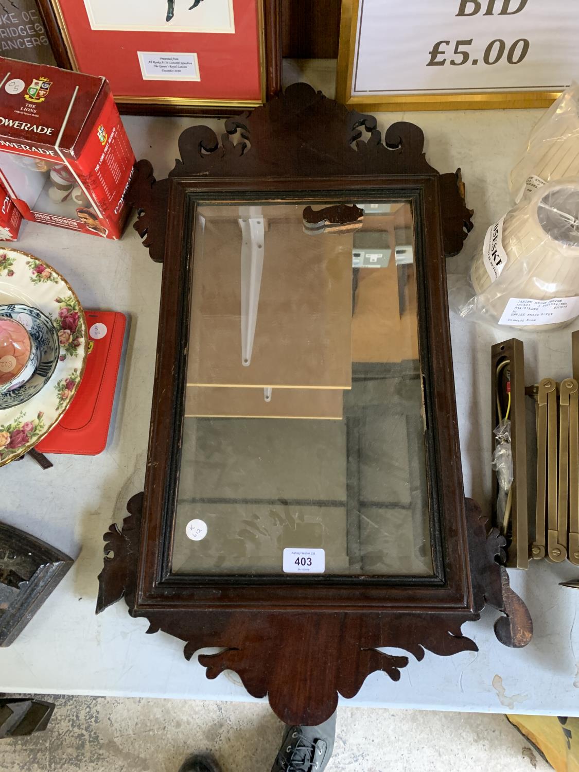 A DECORATIVE MAHOGANY MIRROR