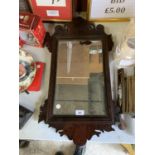 A DECORATIVE MAHOGANY MIRROR