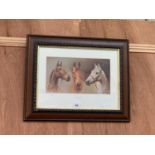 A WOODEN FRAMED PRINT OF THREE HORSES