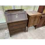 TWO ITEMS - AN OAK BUREAU WITH FALL FRONT AND THREE DRAWERS AND AN OAK CABINET WITH TWO DOORS