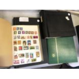 FOUR STAMP ALBUMS CONTAINING VARIOUS STAMPS FROM AROUND THE WORLD