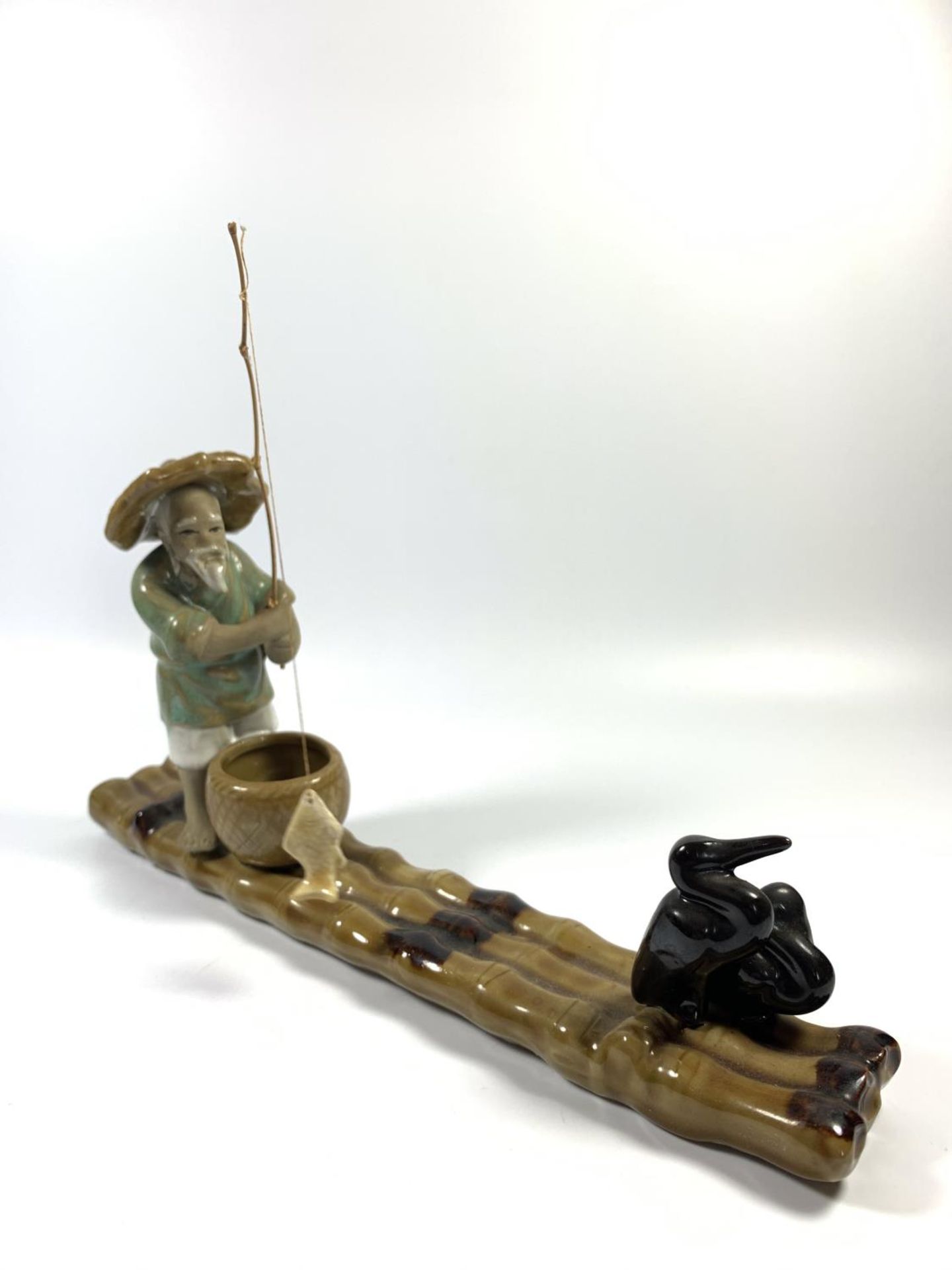 A CHINESE STONEWARE MODEL OF A FISHERMAN ON BAMBOO RAFT, HEIGHT 18CM - Image 4 of 4