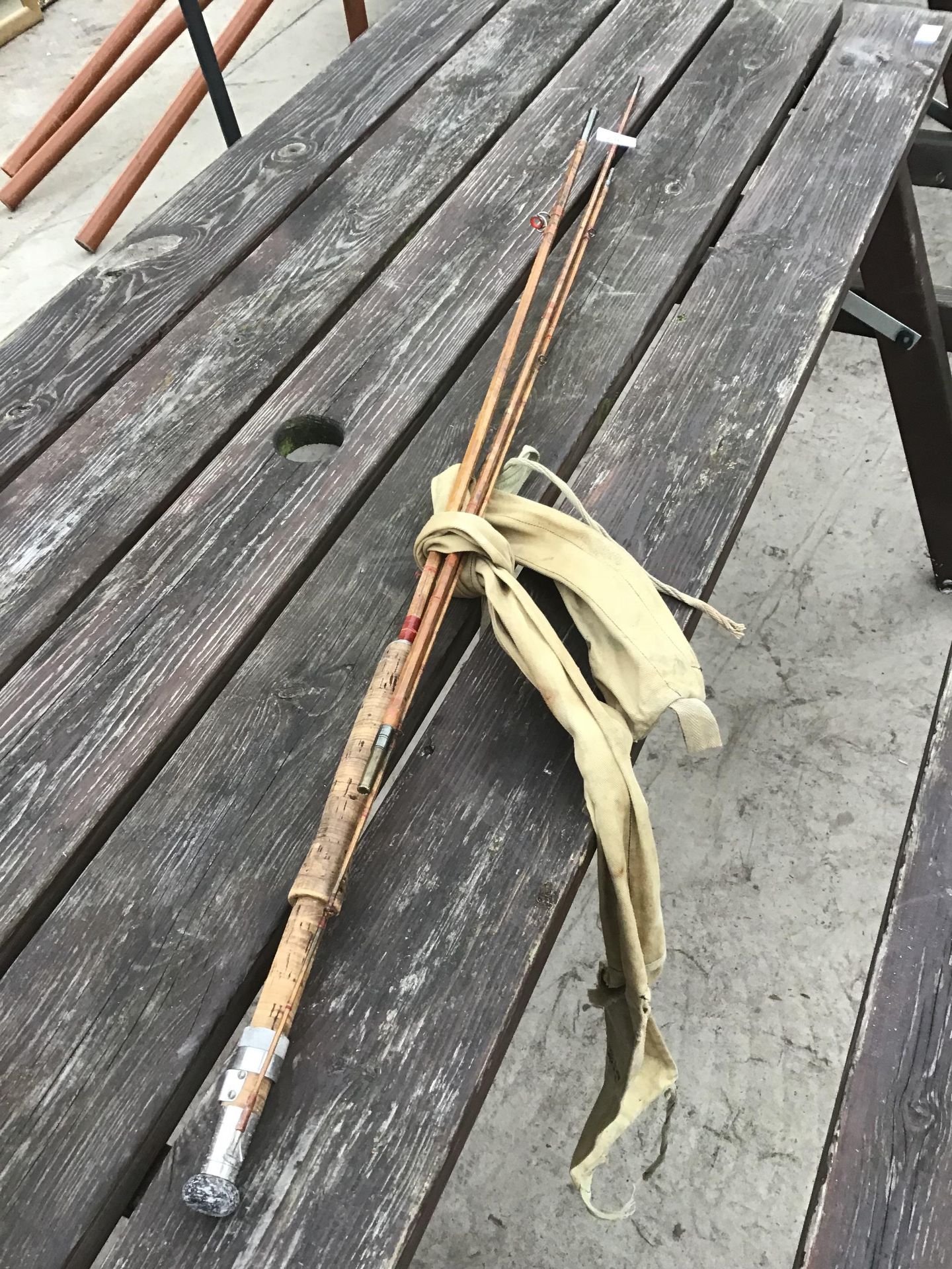A THREE SECTION COARSE FISHING ROD WITH CASE