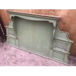 A GREEN PAINTED WOODEN ORNATE OVER MANTLE