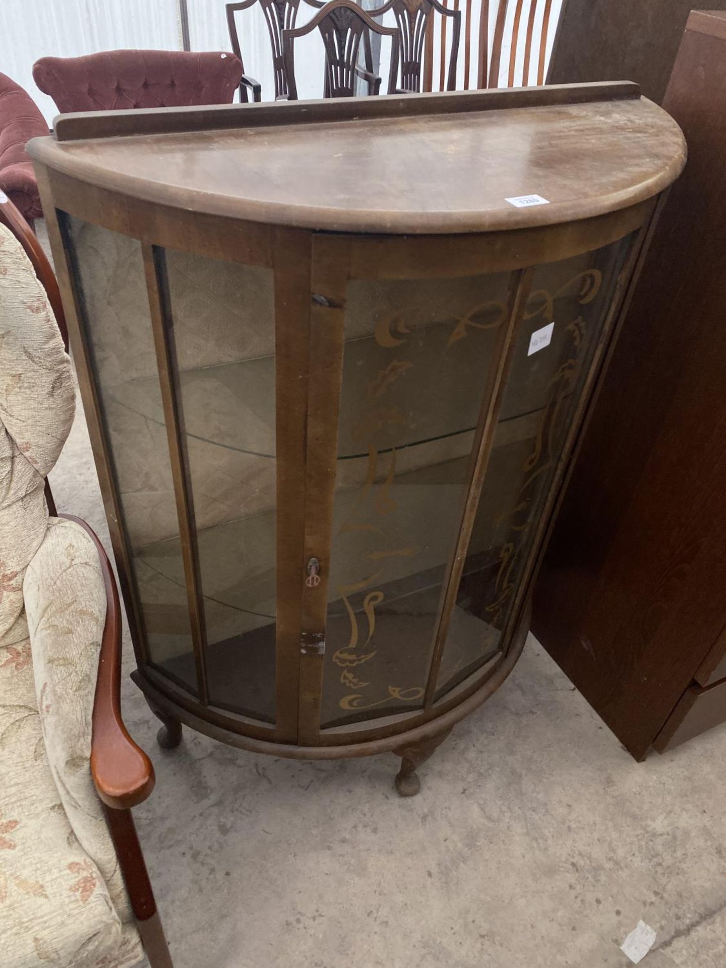 A MAHOGANY BOW FRONT CHINA CABINET