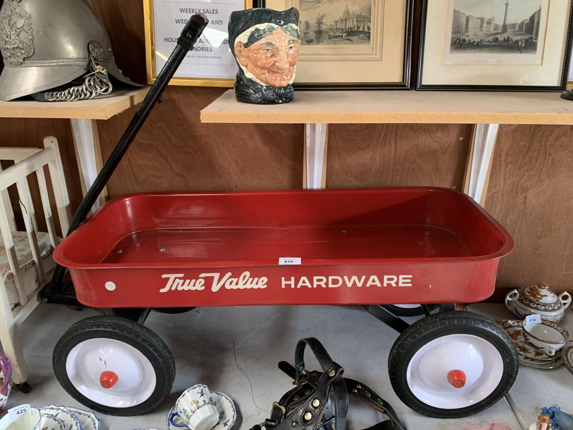 A VINTAGE STYLE 'TRUE VALUE' HARDWARE PULL ALONG TROLLEY