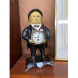 A JOHN BULL CAST IRON MANTLE CLOCK WITH MOVING EYES