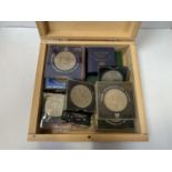 A WOODEN BOX OF COLLECTABLE CROWN COINS