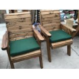 A PAIR OF GARDEN CHAIRS WITH GREEN SEAT PADS