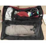 A CRICKET BAG AND CONTENTS TO INCLUDE PADS, HELMET, GLOVES, HAT, BALLS ETC