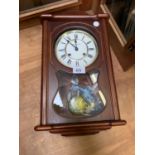 A MODERN 'WIDDUP' CHIMING MANTLE CLOCK WITH PENDULUM AND KEY