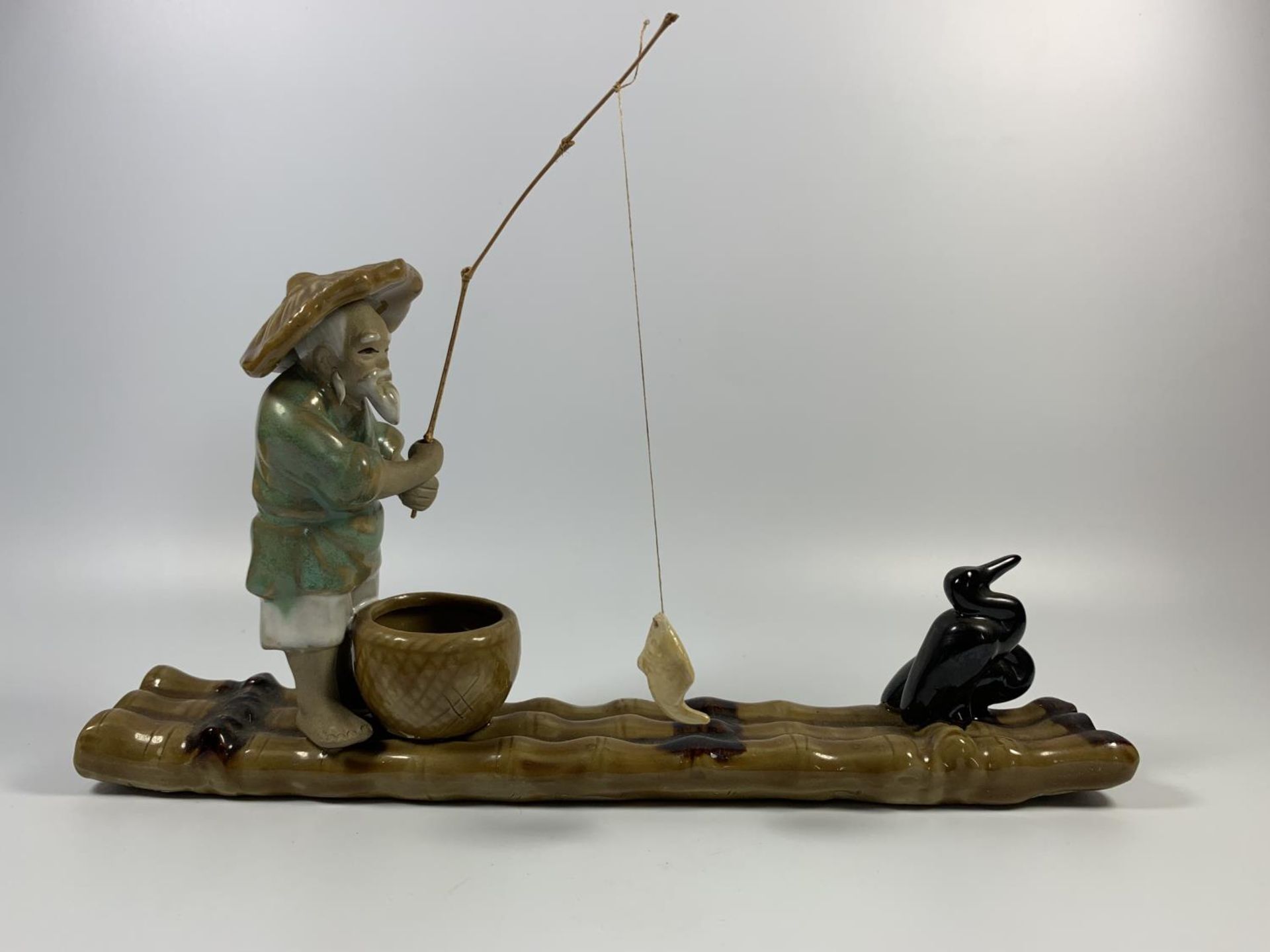 A CHINESE STONEWARE MODEL OF A FISHERMAN ON BAMBOO RAFT, HEIGHT 18CM - Image 2 of 4