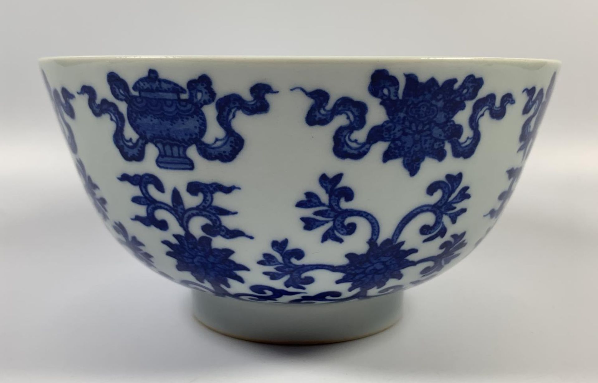 A CHINESE BLUE AND WHITE PORCELAIN BOWL HAVING LOTUS FLOWER DESIGN, QIANLONG MARK TO BASE,