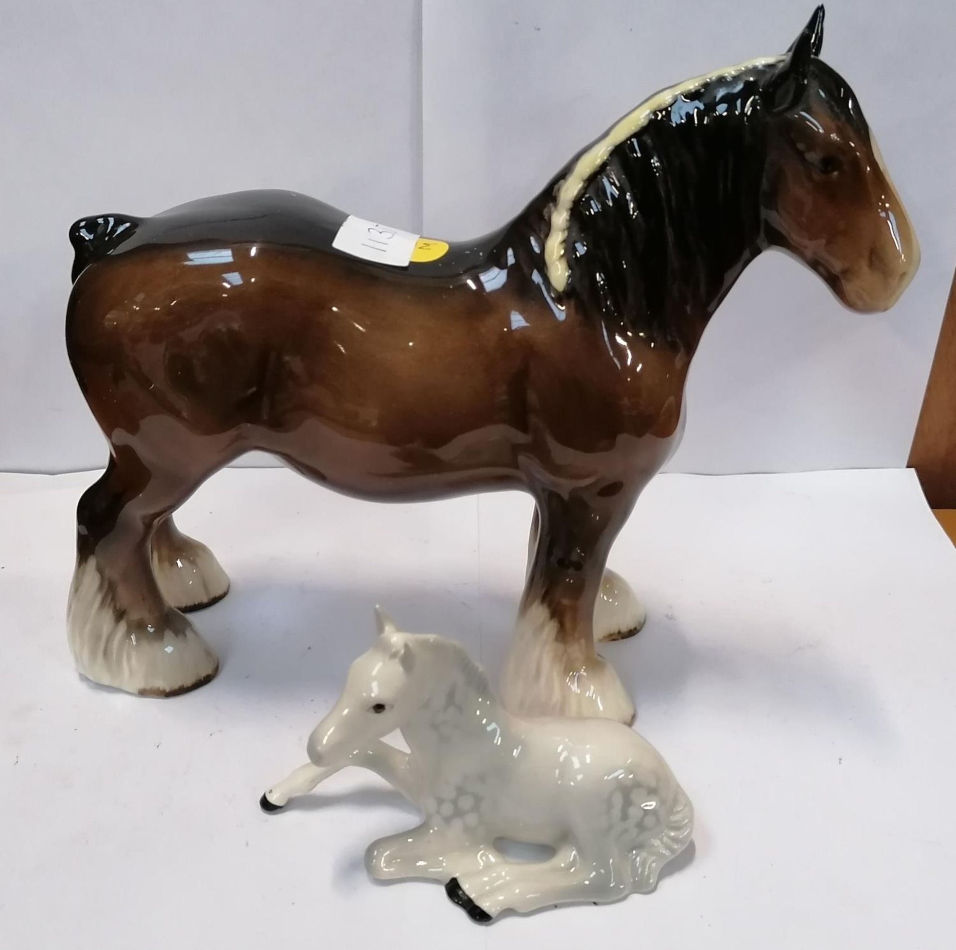 A BESWICK BROWN GLOSS CERAMIC SHIRE MODEL AND FURTHER DAPPLE GREY FOAL (2)